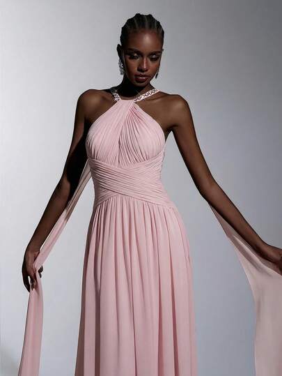 Elitara Elegant, Simple, And Stylish, This Flowing Pink Chiffon Gown Features Handcrafted Rhinestone Chain Embellishments, A Halter Neck, Ruffled Details, A Sexy Open Back, A Shawl, And An A-Line Train. Suitable For All Formal Occasions, Wedding Guests, Dates, Parties, And Elaborate Evening Gowns.