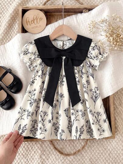 SHEIN Souflis 女婴复古碎花图案黑色领蝴蝶结泡泡袖连衣裙，适合日常穿着和户外活动，春夏款