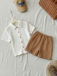 SHEIN Bộ 2 món cho bé trai, gồm áo cardigan trắng trơn dệt kim rỗng, cổ tròn, tay ngắn và quần short kaki ống rộng phối màu tương phản, thích hợp cho mùa xuân/hè, mặc hàng ngày, đi học, du lịch, nghỉ lễ, tiệc tùng. - trắng - Xem 5