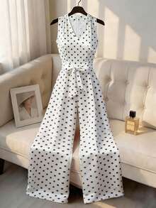 GlowEve Bộ jumpsuit chấm bi cổ chữ V chéo, không tay, có thắt lưng, kiểu dáng thanh lịch, thoải mái cho mùa xuân/hè, thích hợp cho nữ, thích hợp đi nghỉ mát, đi biển hoặc dự tiệc. - Đen và trắng - Xem 5