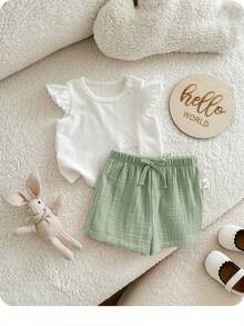 Bộ đồ liền thân mùa hè dễ thương cho bé sơ sinh gồm áo và quần short trắng, có chun co giãn. - Nhiều màu - Xem 5