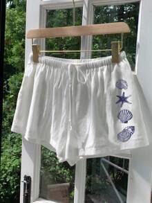 Comfortcana 休闲复古海洋元素蓝色贝壳海星印花图案，适合音乐节、海滩、度假、夏季外出穿着的白色女士系带短裤 - 彩色 - 查看 3