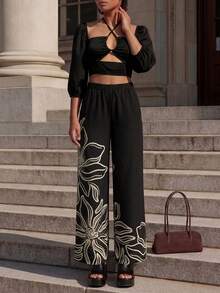 CAJUNI Women's Vacation Solid Color Lantern Sleeve Hollow Out Cropped Halter Top And Floral Print Pants Set - Black - View 3