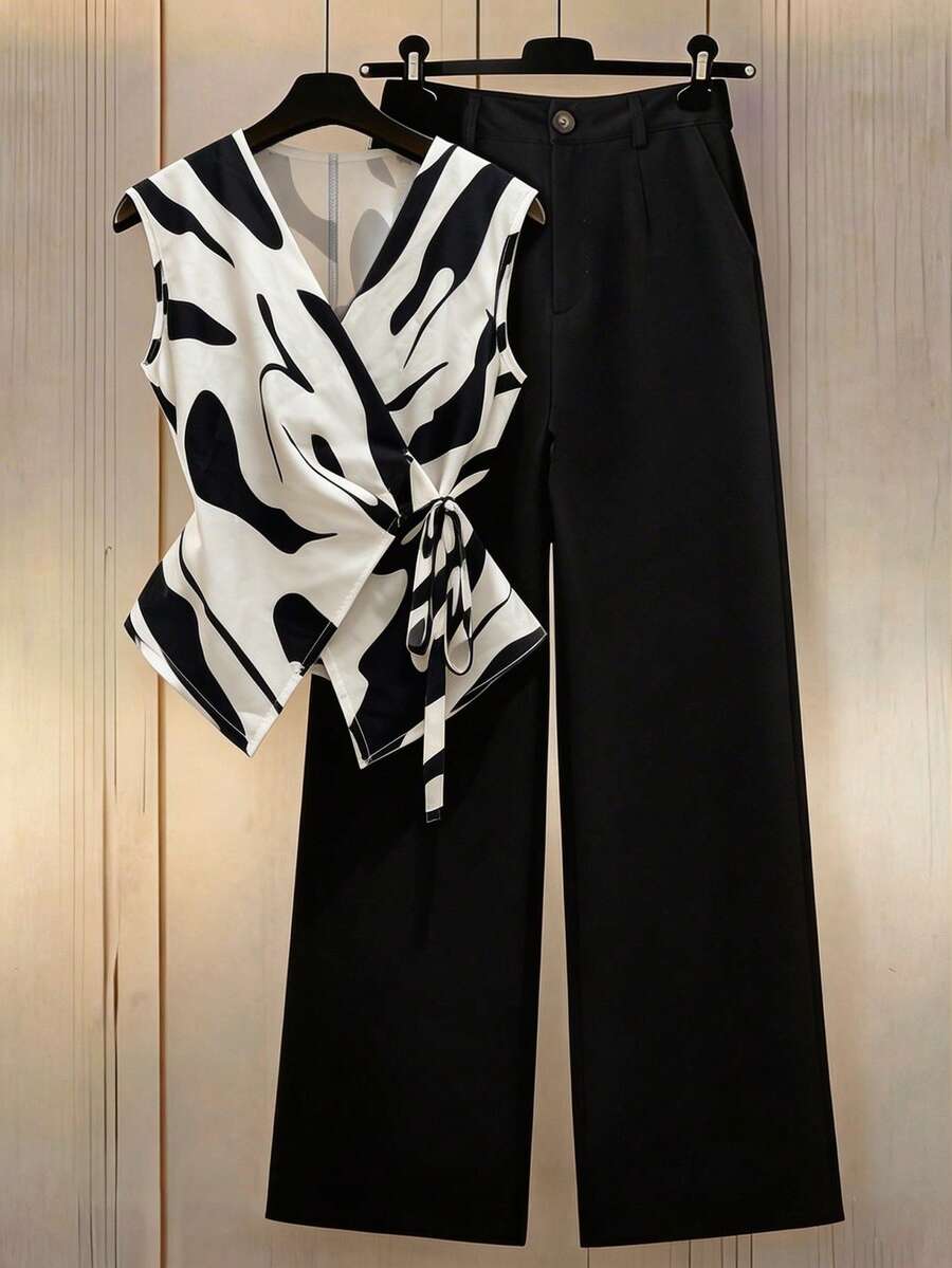 Franclia 女士春夏休闲两件套，宽条纹系带衬衫+纽扣装饰斜插口袋阔腿裤，经典黑白两件套，打造精致通勤造型。无袖黑白条纹上衣，配有可调节系带，V领交叉设计，搭配高腰阔腿裤，实用、简洁、简约、高级，适合通勤、日常穿着、夏季、派对、海滩、约会、毕业典礼、商务办公、都市教师工作服等场合。 - 彩色 - 查看 1