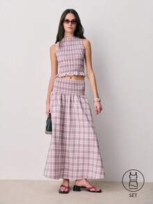 Nöista Bộ đồ hai mảnh không tay kẻ caro với phần thân trên xếp ly và chi tiết bèo nhún ở eo và cổ áo, kết hợp với chân váy xếp ly cùng màu. Nhẹ nhàng và nữ tính, bộ trang phục mùa xuân hè phối hợp này dành cho nữ giới hoàn hảo cho vẻ ngoài thanh lịch thường ngày, trang phục hàng ngày và phong cách thời tiết ấm áp. - Màu tím - Xem 1