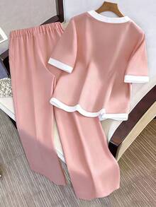 Franclia Bộ đồ nữ gồm áo ngắn tay cổ chữ V phối màu tương phản và quần dài kiểu dáng thường ngày. - Màu Hồng baby - Xem 2