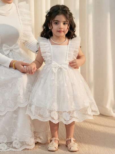 女婴甜美公主风白色蕾丝花朵蝴蝶结装饰蓬蓬裙，适合日常外出、家庭聚会、生日派对和节日活动