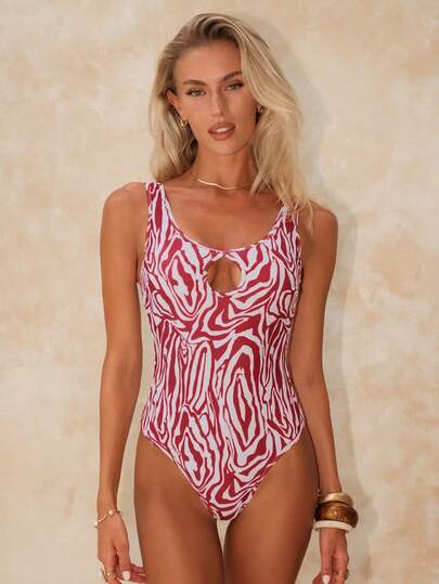 Swim Chiccia Bộ áo liền quần nữ họa tiết da báo với họa tiết nút thắt rỗng.