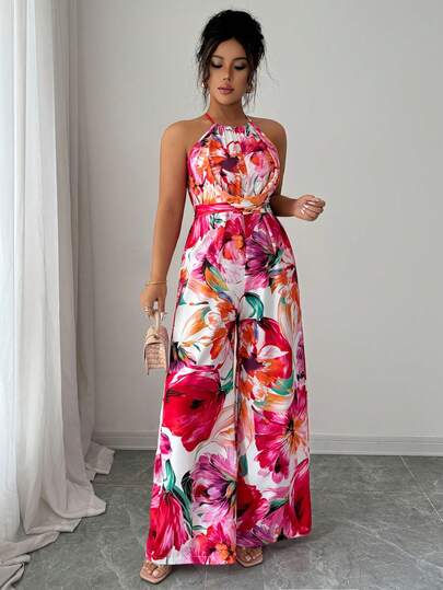Elenzga Bộ jumpsuit nữ cổ tròn in hoa, không tay, ống rộng, thắt eo, kiểu dáng lãng mạn, tôn dáng, thiết kế chéo, eo chun, phong cách retro Pháp, thích hợp cho mặc hàng ngày, đi biển, nghỉ lễ, hẹn hò, mùa hè. Bộ jumpsuit ống rộng mới về.