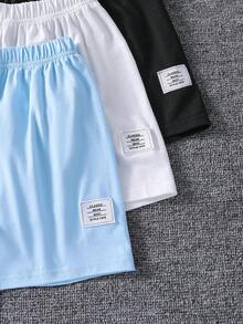 SHEIN 6件套儿童夏季休闲简约时尚圆领T恤短裤套装，包含蓝色、黑色和白色三套儿童短袖短裤套装。款式简约，短袖搭配短裤，日常穿着舒适，适合儿童，活动自如，设计简洁，易于搭配其他配饰或外套，可作为满足日常休闲需求的儿童基本款服装。 - 彩色 - 查看 5