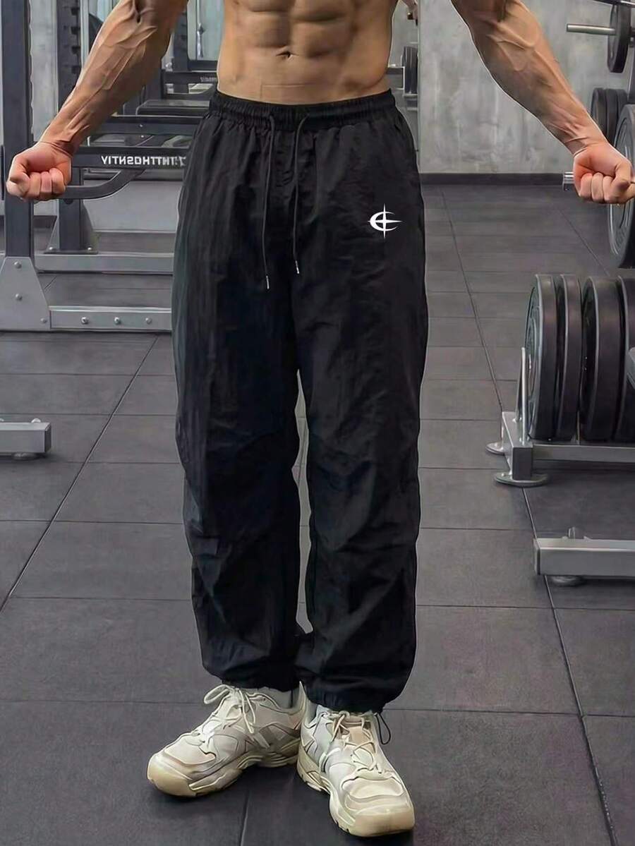 GymBeat Pantalones de chándal holgados con estampado gráfico y cordón en la cintura, para gimnasio - Negro - Ver 1