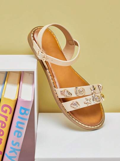 Mini mi #OceanCharm Sandalias planas de niña con doble correa, decoración de concha y estrella de mar, suela con ribete dorado, elegante y de playa