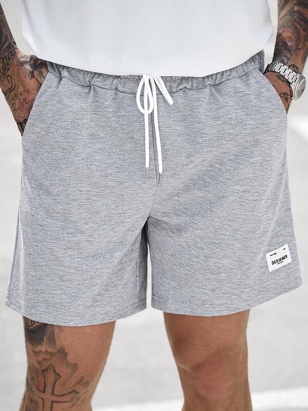 Manfinity CasualCool Quần short nam dáng rộng, có dây rút, đa năng, thích hợp mặc hàng ngày.