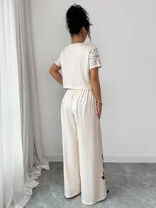Elenzga Bộ đồ 2 mảnh mùa Xuân/Hè thanh lịch, thường ngày gồm áo thun cổ tròn in họa tiết và quần ống rộng, thích hợp cho Lễ Tạ ơn, Halloween, mặc ở nhà, đi chơi hoặc du lịch. - Nhiều màu - Xem 2