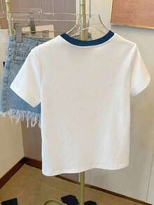 SHEIN Este mono de camiseta casual para niñas preadolescentes presenta una impresión única en el pecho que irradia un ambiente, un cuello redondo contrastante y detalles recogidos en la cintura para un ajuste favorecedor. La tela es elástica, cómoda y transpirable, lo que la hace adecuada para el uso diario, los deportes, las vacaciones, la escuela y otras ocasiones. Es un elemento esencial de verano de alta calidad y versátil. - Blanco - Ver 7