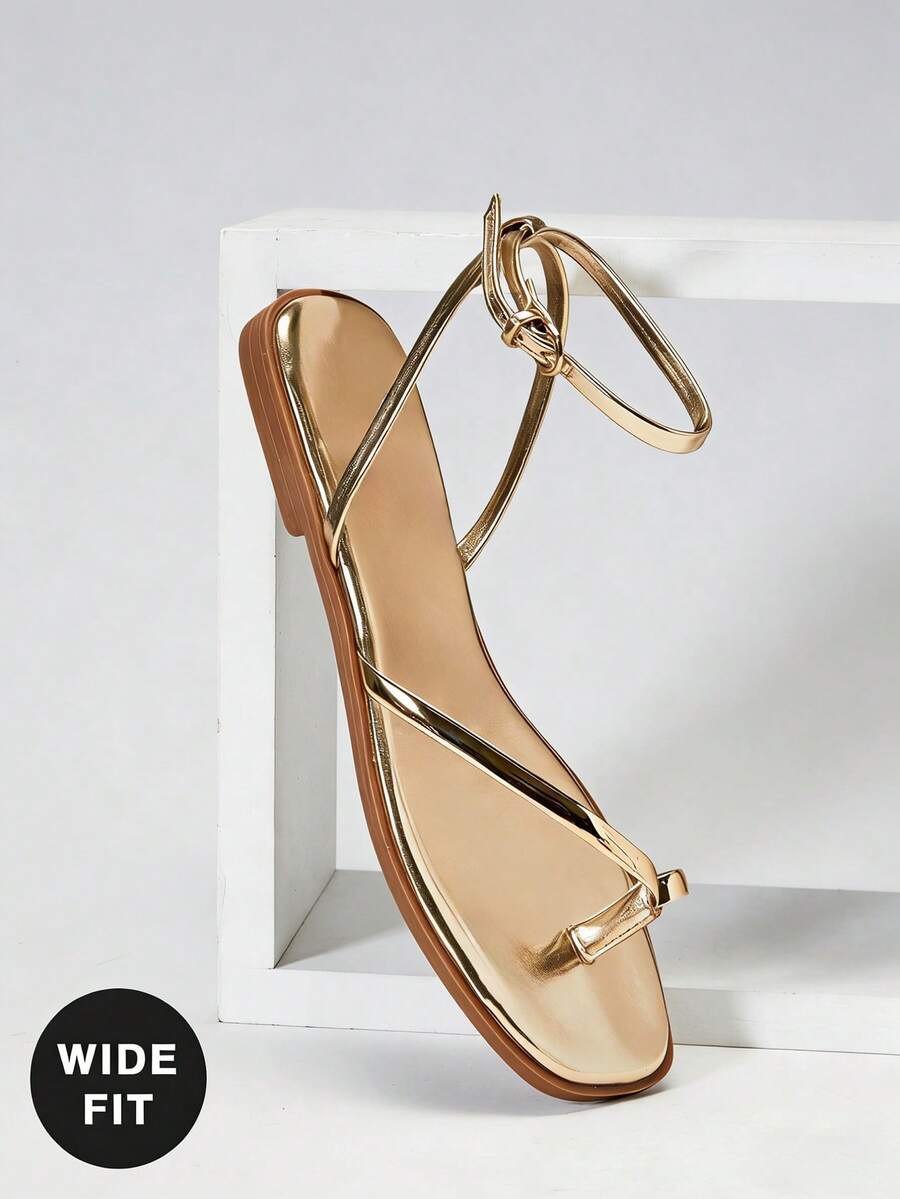 SHUZIA #Giày sandal đế bằng UrbanLuxe dành cho nữ, kiểu dáng rộng rãi, quai TPU mạ vàng nhạt, quai ngang mắt cá chân, có vòng đeo ngón chân – Phong cách thanh lịch, tối giản và sang trọng cho mỗi ngày. - Vàng - Xem 1