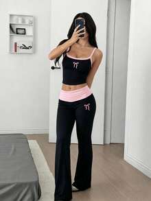 Bộ đồ nữ gồm áo hai dây in nơ và quần ống loe, thích hợp mặc hàng ngày vào mùa xuân/hè. - màu đen - Xem 4