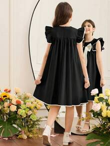 SHEIN Đầm bé gái kiểu dáng thanh lịch thành thị, cổ tròn, viền tương phản, tay loe, đính nơ lớn, dáng chữ A, màu trắng, chất liệu vải dệt, cổ búp bê. - Đen và trắng - Xem 2