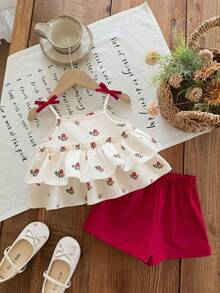 SHEIN Bộ đồ 2 mảnh dễ thương cho bé gái, gồm áo ba lỗ đen và quần short trắng đơn giản, được trang trí hoa 3D, rất phù hợp cho các bữa tiệc sinh nhật, tiệc tùng, biểu diễn, đám cưới, lễ rửa tội, lễ khai trương, mặc hàng ngày, đi học, dã ngoại và mùa xuân/hè. - màu đen - Xem 6