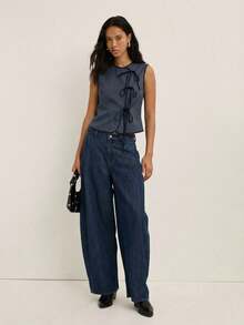 Nöista Áo tank top nữ gân sọc với cổ tròn cổ điển và chi tiết buộc dây phía trước, được thiết kế để tôn dáng và có thể điều chỉnh. Một món đồ đa năng và thoải mái, hoàn hảo cho những buổi đi làm hàng ngày hoặc những bộ trang phục mùa xuân và mùa hè dễ phối. - Màu xanh bụi bặm - Xem 6