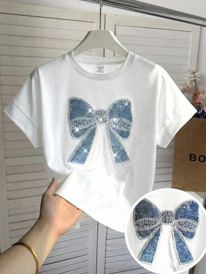 SHEIN Áo thun ngắn tay cổ tròn thêu hoa, kiểu dáng thanh lịch retro Pháp dành cho bé gái tuổi teen mùa xuân/hè, chất liệu giả denim, màu trắng.