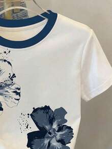 SHEIN Este mono de camiseta casual para niñas preadolescentes presenta una impresión única en el pecho que irradia un ambiente, un cuello redondo contrastante y detalles recogidos en la cintura para un ajuste favorecedor. La tela es elástica, cómoda y transpirable, lo que la hace adecuada para el uso diario, los deportes, las vacaciones, la escuela y otras ocasiones. Es un elemento esencial de verano de alta calidad y versátil. - Blanco - Ver 9