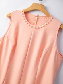 GlowEve CURVE Bộ đồ 2 món dành cho nữ cỡ lớn: Áo khoác cardigan dài tay cổ chữ V màu đen phối ngọc trai tương phản thanh lịch và váy maxi cổ tròn đính ngọc trai, phù hợp cho mùa thu/đông, đi làm và các dịp đặc biệt. - Màu Cam san hô - Xem 3