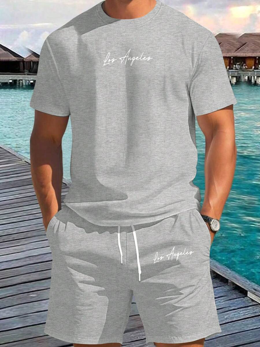 Manfinity RSRT Ensemble décontracté quotidien, vacances, composé d'un t-shirt à col rond à manches courtes avec imprimé lettres et d'un short pour homme - Multicolore - Voir 1