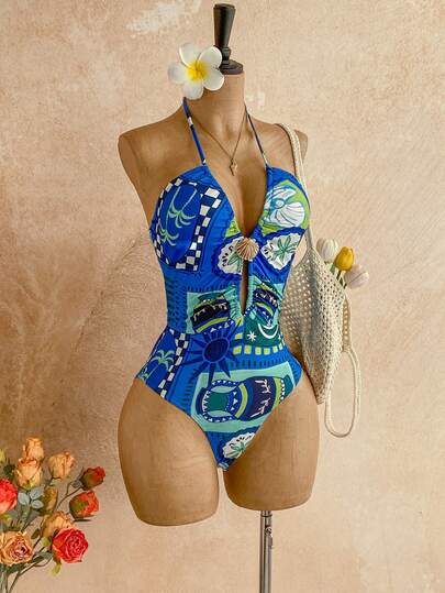 Soleia 这款女士夏季度假沙滩户外连体裤采用海洋主题印花图案，修身剪裁，并饰有镂空金属细节。适合派对、约会、嘉年华、温泉、海滩、邮轮、城市度假等各种场合。