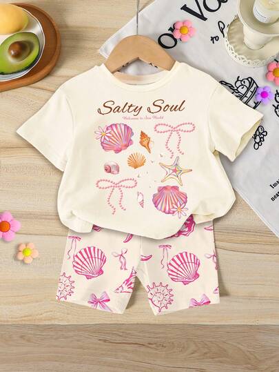 SHEIN Set de 2 piezas con estampado de criaturas marinas, conchas y lazos para niñas bebé: camiseta de manga corta de cuello redondo holgada y shorts ajustados, adecuado para primavera/verano, uso casual, playa, fin de semana. Conjunto adorable de verano para niña bebé, estilo coreano, ropa de verano, conjunto de conchas para niña bebé, conjunto de playa para niña bebé