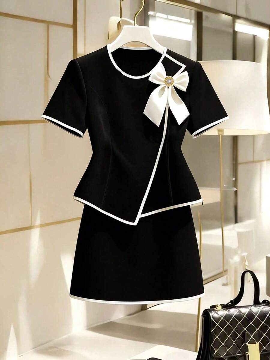 Franclia Bộ đồ nữ màu đen trắng phối nơ thanh lịch, tối giản, thích hợp cho công sở, gồm 2 món. - màu đen - Xem 1