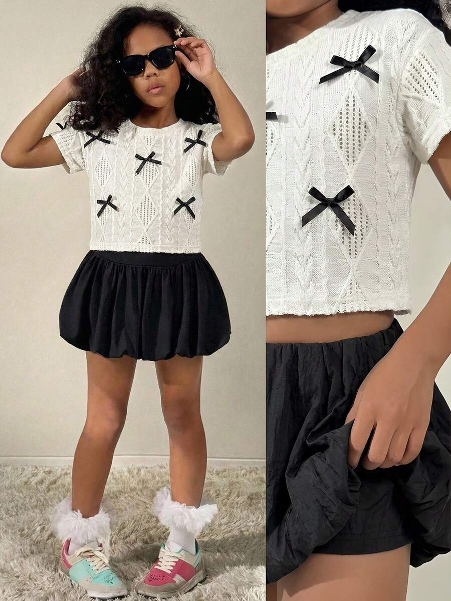SHEIN 两件套女童夏季套装，白色上衣配黑色蝴蝶结，黑色泡泡裙，适合返校、返校节穿着。可爱优雅的蝴蝶结装饰短袖上衣搭配松紧腰裙。 - 黑與白 - 查看 1