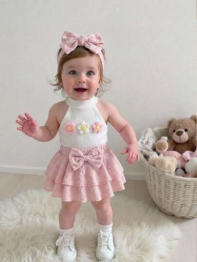 SHEIN Baby Girl Sweet Vacation Style 3D Floral Decor Halter Top And Jacquard Bowknot Elastic Waist Double Layered Hem Skirt Set, Summer