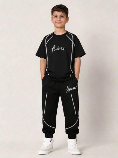 SHEIN Bộ đồ thể thao 2 món cho bé trai tuổi teen, gồm áo thun cổ tròn và quần short phối màu tương phản, thích hợp cho các dịp xuân/hè như đi chơi, hẹn hò, du lịch, nghỉ lễ, họp mặt gia đình, đi học, đám cưới, tiệc tùng, thể thao.