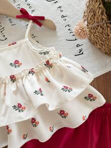 SHEIN Bộ đồ 2 mảnh dễ thương cho bé gái, gồm áo ba lỗ đen và quần short trắng đơn giản, được trang trí hoa 3D, rất phù hợp cho các bữa tiệc sinh nhật, tiệc tùng, biểu diễn, đám cưới, lễ rửa tội, lễ khai trương, mặc hàng ngày, đi học, dã ngoại và mùa xuân/hè. - màu đen - Xem 2