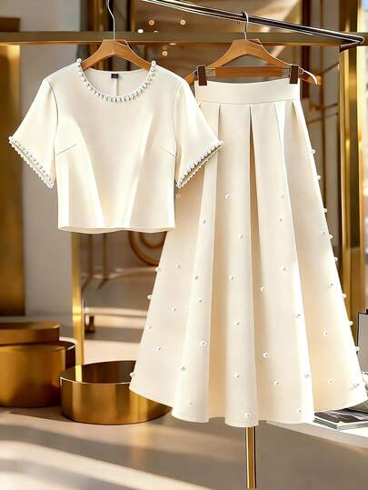 GlowEve CURVE 大码女式圆领仿珍珠装饰短袖上衣搭配百褶裙休闲套装