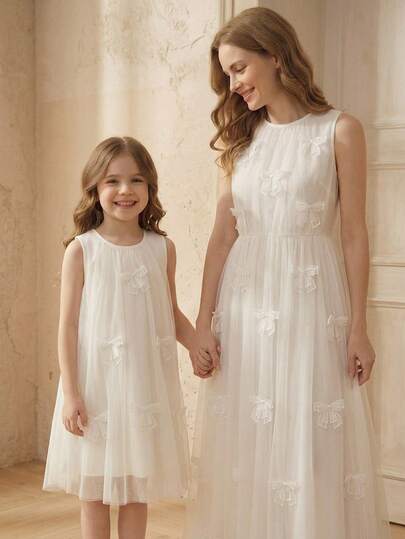 SHEIN Vestido casual de vacaciones con cuello redondo y decoración de lazo para niña