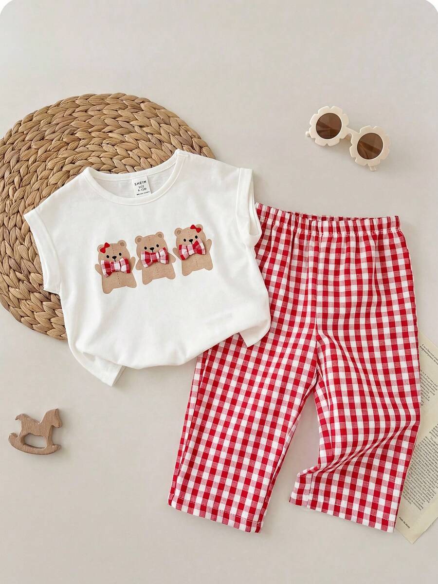 SHEIN LMoss Kids Bộ đồ 2 món dễ thương, đa năng cho bé gái, gồm áo nỉ cổ tròn kẻ sọc và quần đen bó sát, thích hợp cho mùa thu và mùa đông. Phù hợp cho các bữa tiệc sinh nhật, tiệc tối, biểu diễn, đám cưới, lễ rửa tội, lễ khai trương, trong nhà và ngoài trời, sử dụng hàng ngày, thể thao, vui chơi, tiệc tùng, chụp ảnh, kỳ nghỉ, lễ hội. Thích hợp cho mùa thu và mùa đông. - Đen và trắng - Xem 1