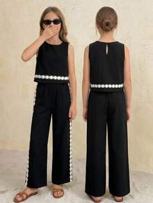 SHEIN Bộ đồ thể thao thường ngày cho bé gái tuổi teen, màu đen, cổ tròn, không tay, viền gấu, gồm áo ôm sát và quần ống rộng suông, 2 món. - màu đen - Xem 2
