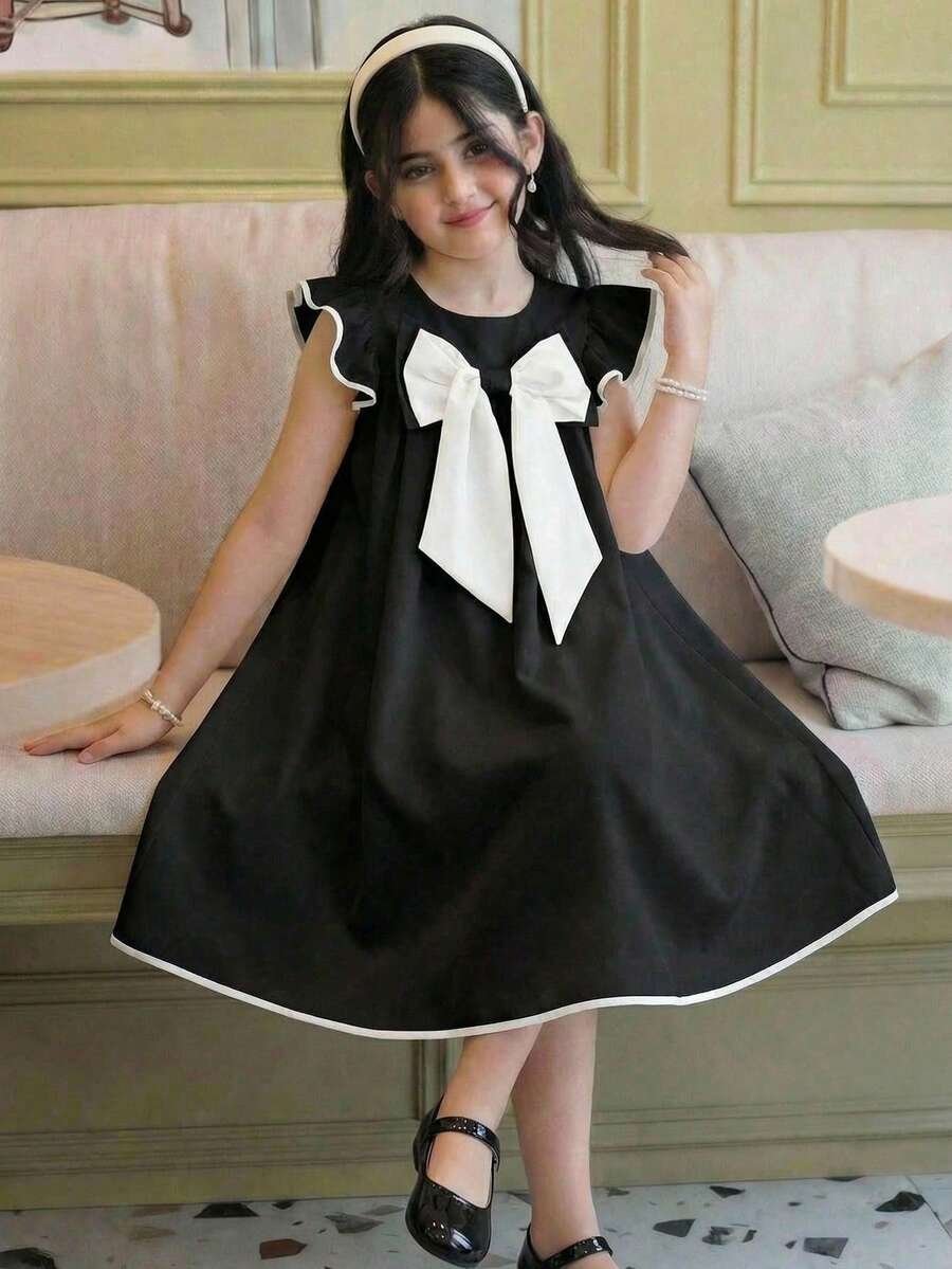 SHEIN Đầm bé gái kiểu dáng thanh lịch thành thị, cổ tròn, viền tương phản, tay loe, đính nơ lớn, dáng chữ A, màu trắng, chất liệu vải dệt, cổ búp bê. - Đen và trắng - Xem 1