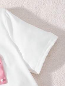 Conjunto de verano dulce y enérgico para niñas preadolescentes, camiseta de manga corta bicolor roja y blanca con gran lazo y decoración de perlas falsas + pantalones falda asimétrica, adecuado para salidas, actuaciones, citas - Rosa - Ver 4