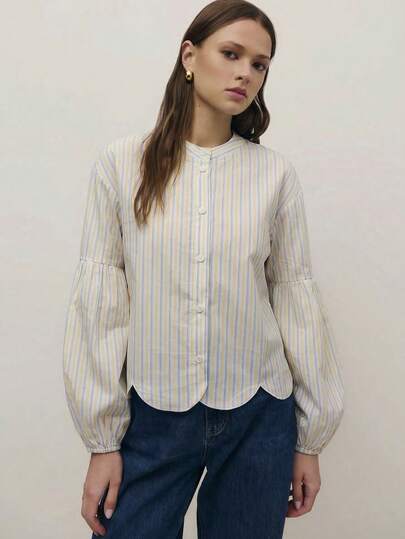 Nöista 蓝色条纹常规版型衬衫，下摆呈扇形，长袖袖口采用弹性设计。适合春夏穿着，休闲百搭。