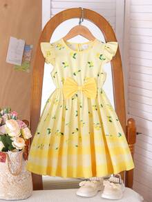 Đầm chữ A tay ngắn thắt nơ họa tiết kẻ caro chanh ngọt ngào cho bé gái, thích hợp cho các buổi đi chơi mùa hè. - Nhiều màu - Xem 4