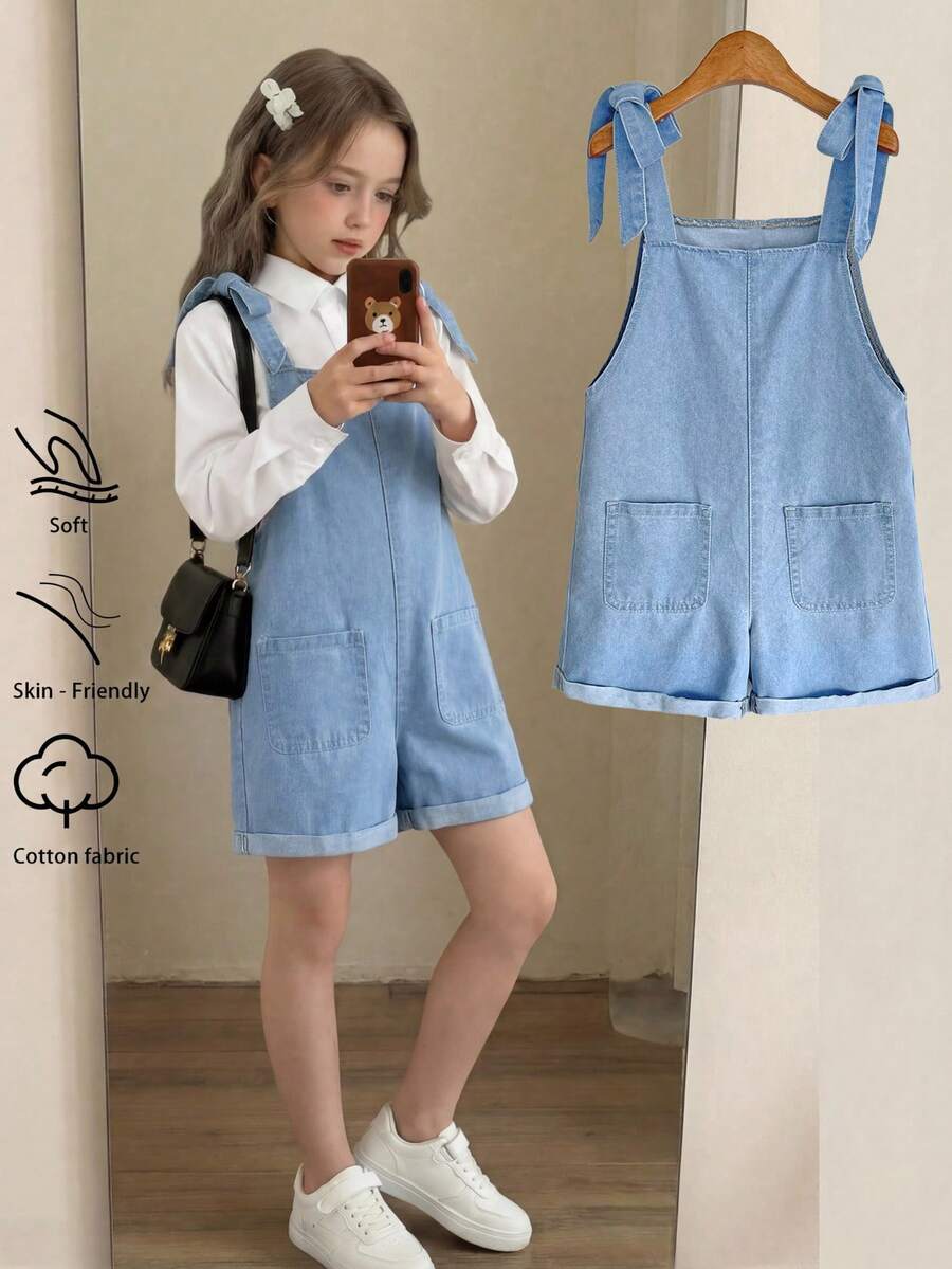 SHEIN 青少年女孩優雅度假休閒寬鬆蝴蝶結牛仔吊帶褲,捲邊設計,夏季波希米亞風度假連身褲,適合春夏,復古/海灘/海洋/優雅畢業造型,夏季假期春季海灘度假情人節穿搭,夏季可愛吊帶褲 - 淺色水洗藍 - 查看 1
