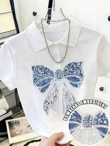 Áo thun nữ tay ngắn cổ tròn, dáng casual, in hình nơ và đính ngọc trai. - Nhiều màu - Xem 1