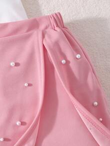 Conjunto de verano dulce y enérgico para niñas preadolescentes, camiseta de manga corta bicolor roja y blanca con gran lazo y decoración de perlas falsas + pantalones falda asimétrica, adecuado para salidas, actuaciones, citas - Rosa - Ver 5