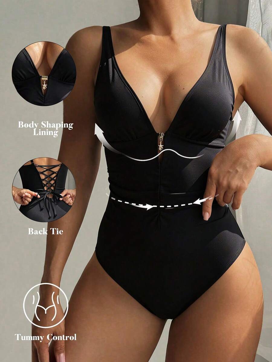 Shapewave Bộ đồ bơi liền thân thời trang dành cho nữ, màu đen và vàng lấp lánh: Với màu đen làm chủ đạo và điểm nhấn là các chi tiết kim loại màu vàng, tạo nên vẻ sang trọng và bí ẩn của một tín đồ thời trang. - màu đen - Xem 1