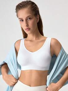 Loungeista Sujetador deportivo inalámbrico sin costuras, sujetador de yoga cómodo con almohadillas extraíbles - Blanco - Ver 1