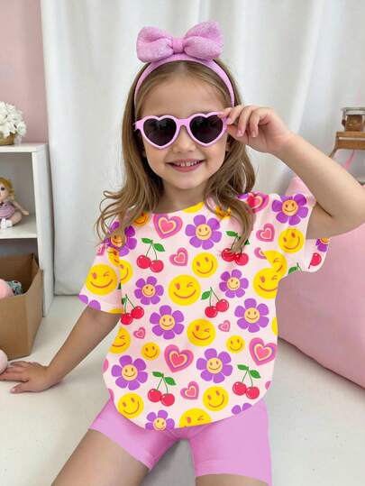 SHEIN Tvådelat set med blommönster, rund hals, kortärmad t-shirt och smala shorts för ung flicka, avslappnad minimalistisk stil, lämplig för vår/sommar, vardagskläder, gatustil, semester, utomhus, sport, högtid