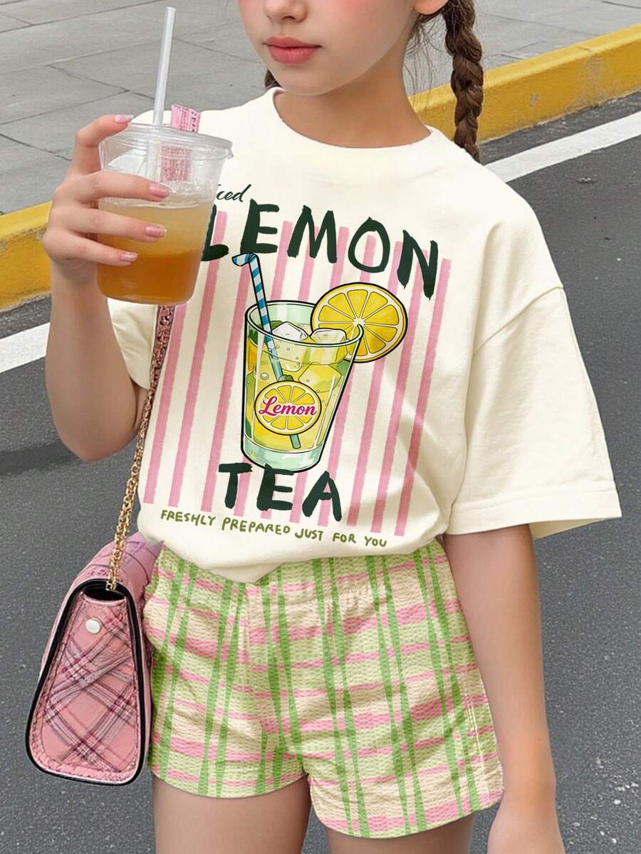 SHEIN 两件套女童休闲海岛度假沙滩柠檬茶印花圆领短袖T恤和撞色格纹短裤,适合春夏日常穿着、街头风、度假、农场、度假村等场合。 - 彩色 - 查看 1